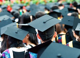 back of graduates in cap and gown